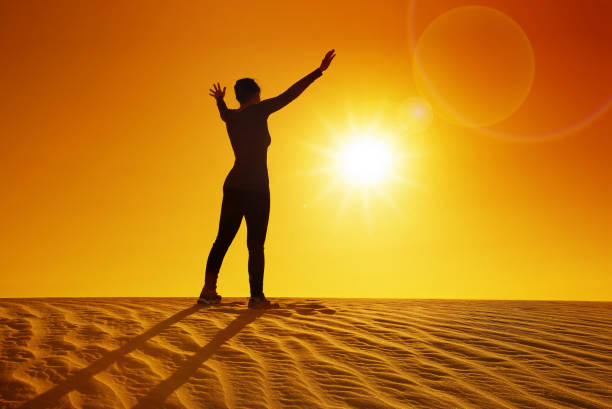 istock female silhouette on a sand dune 840465660