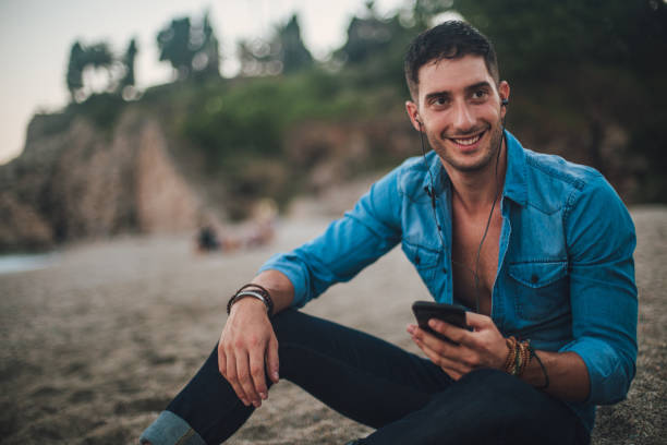 istock Resting with music on the beach 840468612