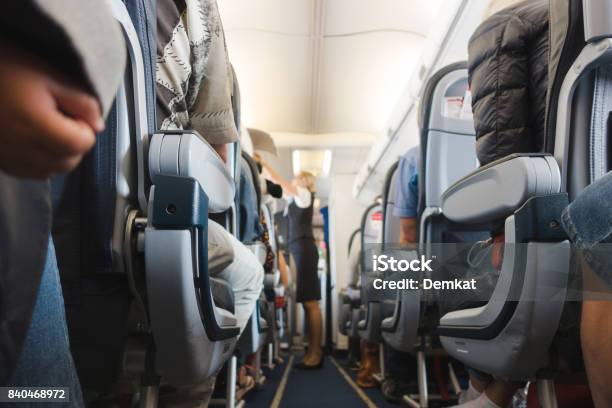 Cabin Aisle In Airplane Stock Photo - Download Image Now - Air Stewardess, Comfortable, Commercial Airplane