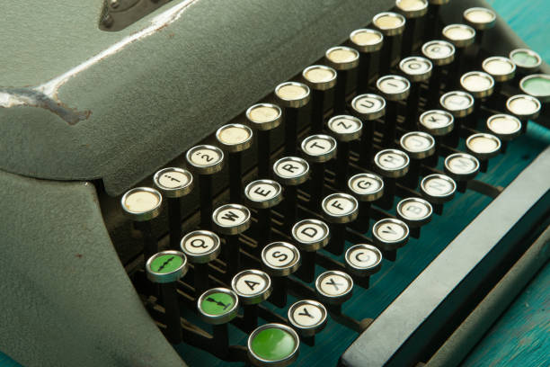 istock typewriter on the blue wooden desk 840472666