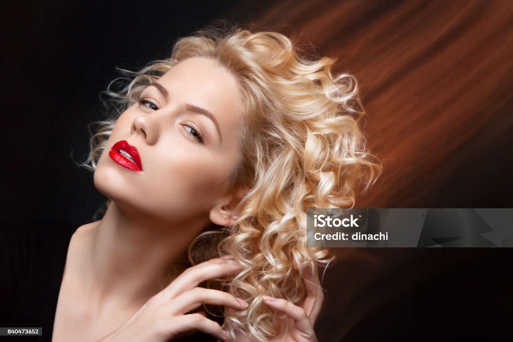 Portrait Of A Attractive Woman With Blonde Curly Hair In Mixed Light Stock  Photo - Download Image Now - iStock