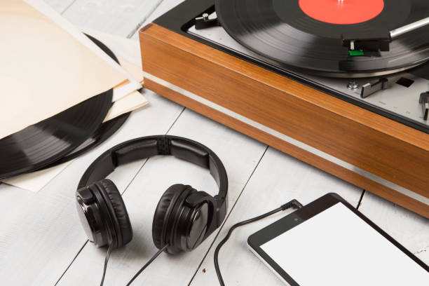 istock Vintage turntable, smartphone and headphones 840474348