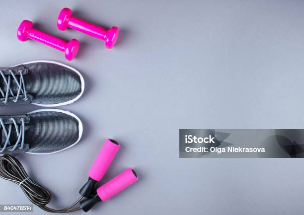 Flat Lay Shot Of Sneakers Jumpung Rope And Dumbbells Stock Photo - Download Image Now