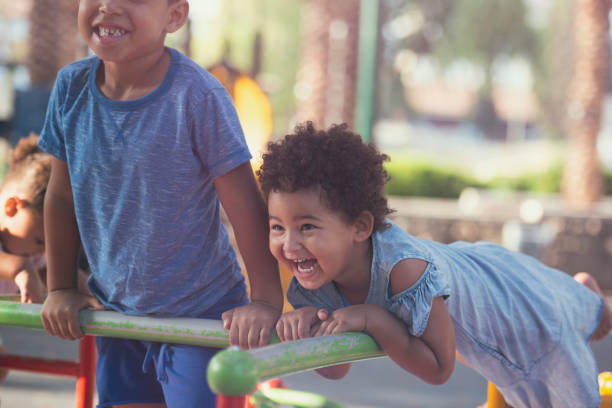 istock Kids enjoying playing at playground. 840481714