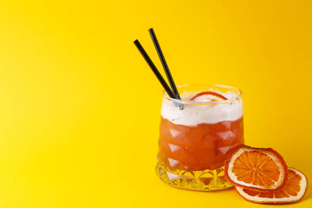 istock Orange cocktail with citron on colorful background 840482022