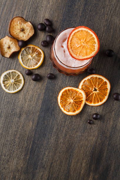 istock Orange cocktail with citron on wooden background 840482236