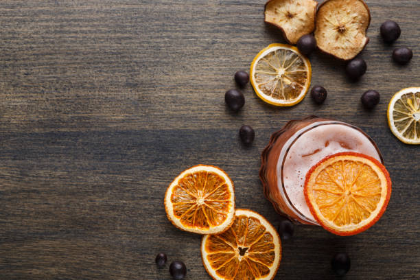 istock Orange cocktail with citron on wooden background 840482394
