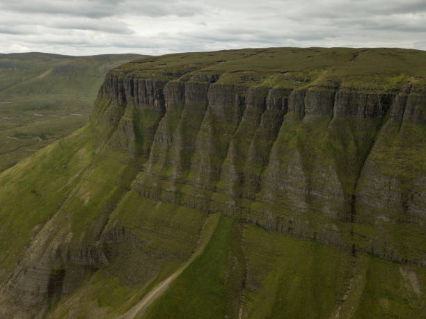 Elevated view of Benbulben mountain range, Co. Sligo, Ireland. Dramatic views of Benbulben mountain range for above, Sligo, Ireland. ben bulben stock pictures, royalty-free photos & images