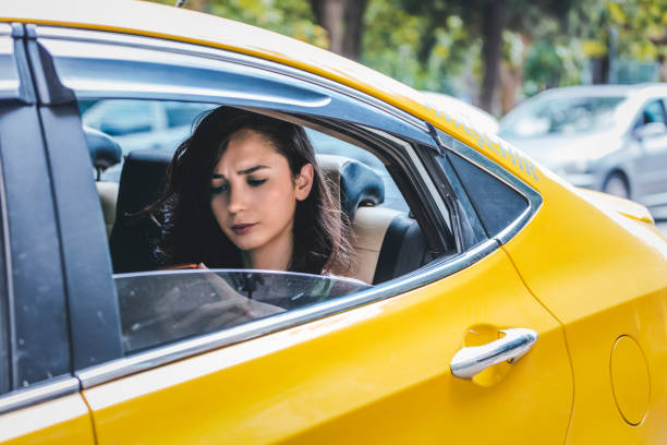 istock Young woman in taxi 840489068