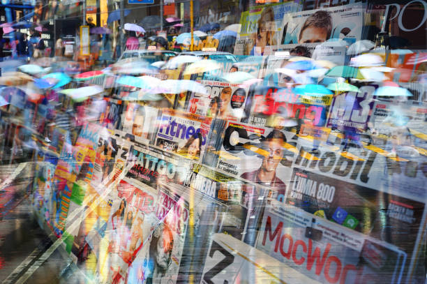 istock Swedish news stand, mixed magazines, umbrellas reflected in window 840493070
