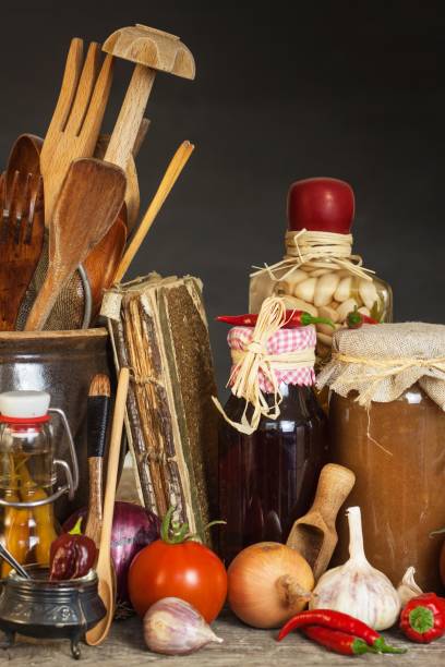 istock Kitchen table and cooking ingredients. Vegetables and kitchen tools. Recipe for healthy food. Advertising for home cooking. 840493094