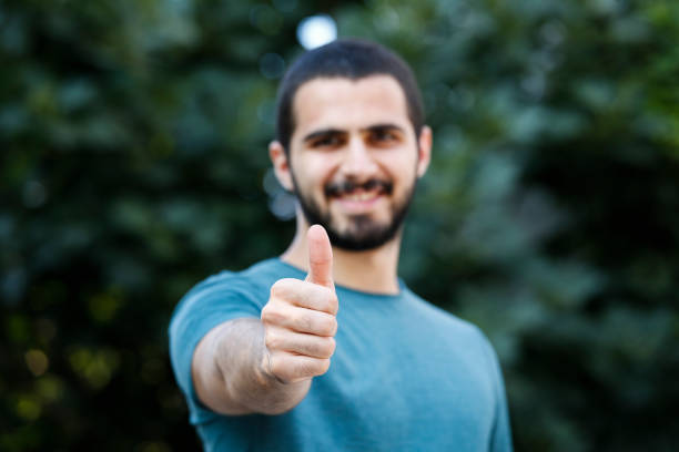 istock Happy smiling man giving thumbs up 840496814