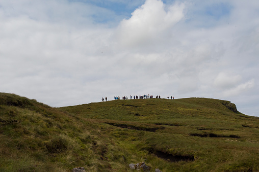 Large group of hill walkers on the ridge of Benbulben, Co. Sligo, Ireland.