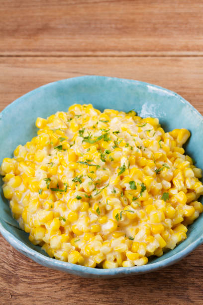 istock Creamy corn in bowl on wooden background 840504504