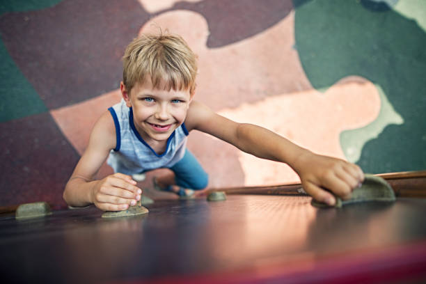 istock Little boy climbing in playground 840504618