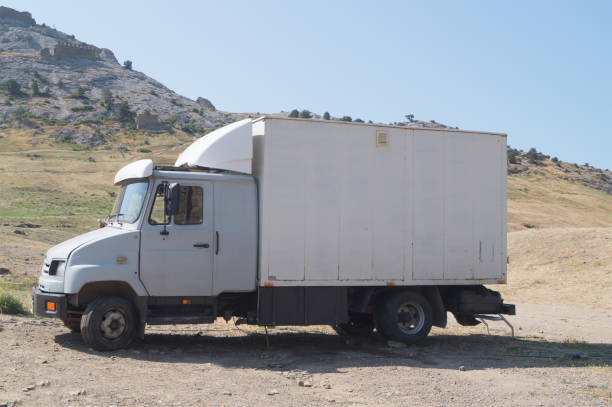 Sudak, Crimea, Russia, June 29, 2017: Grey cargo automobile parked near the mountain