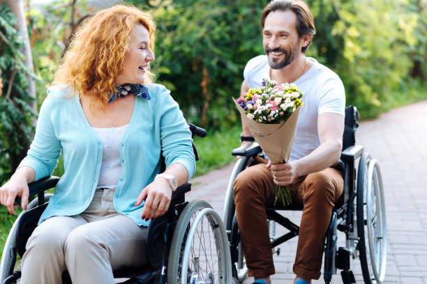 istock Positive senior man presenting a bunch of flowers 840506484