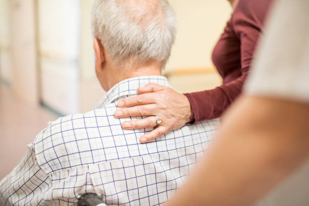 istock Disabled man with wife in hospital 840509692