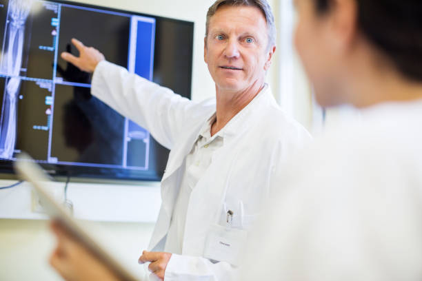 istock Radiologist explaining medical scan results to nurse 840513334