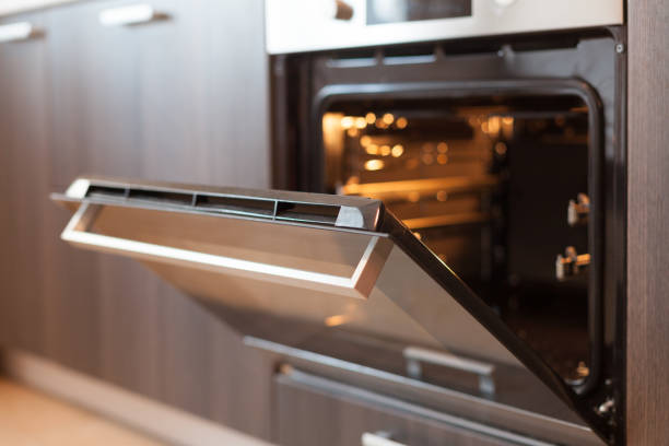 istock Empty open electric oven with hot air ventilation. New oven. Door is open and light is on. 840514558