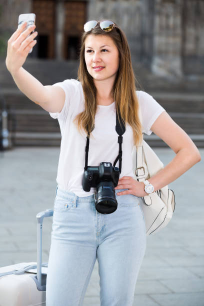 istock Young  traveler walking the city and doing selfie 840514920