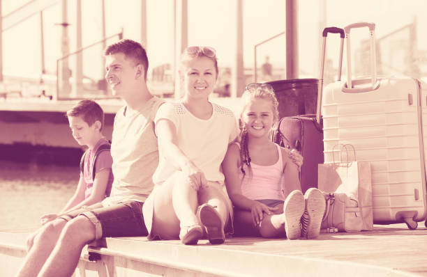 istock Nice parents with two kids travelling together 840517232