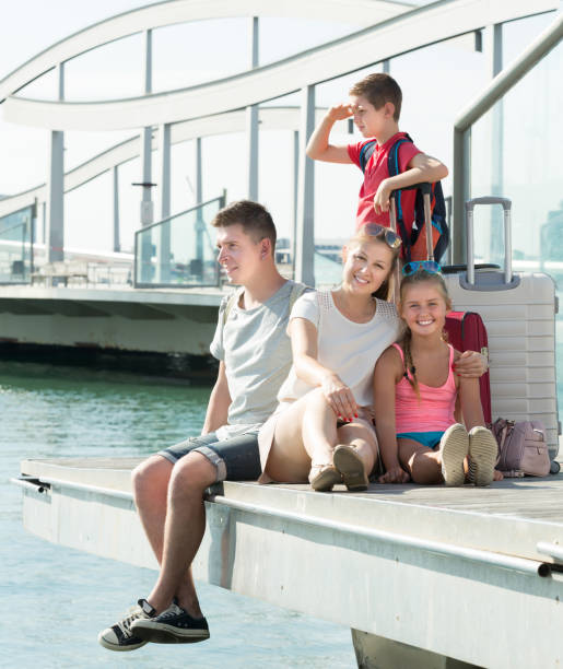 istock Happy parents with two kids travelling together 840517256