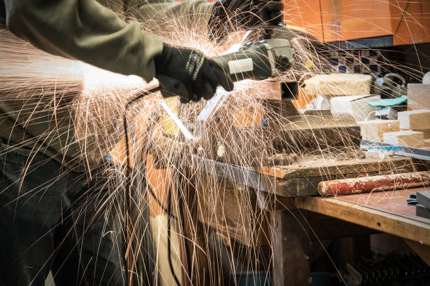 istock Man working with electric grinder tool on steel 840519018