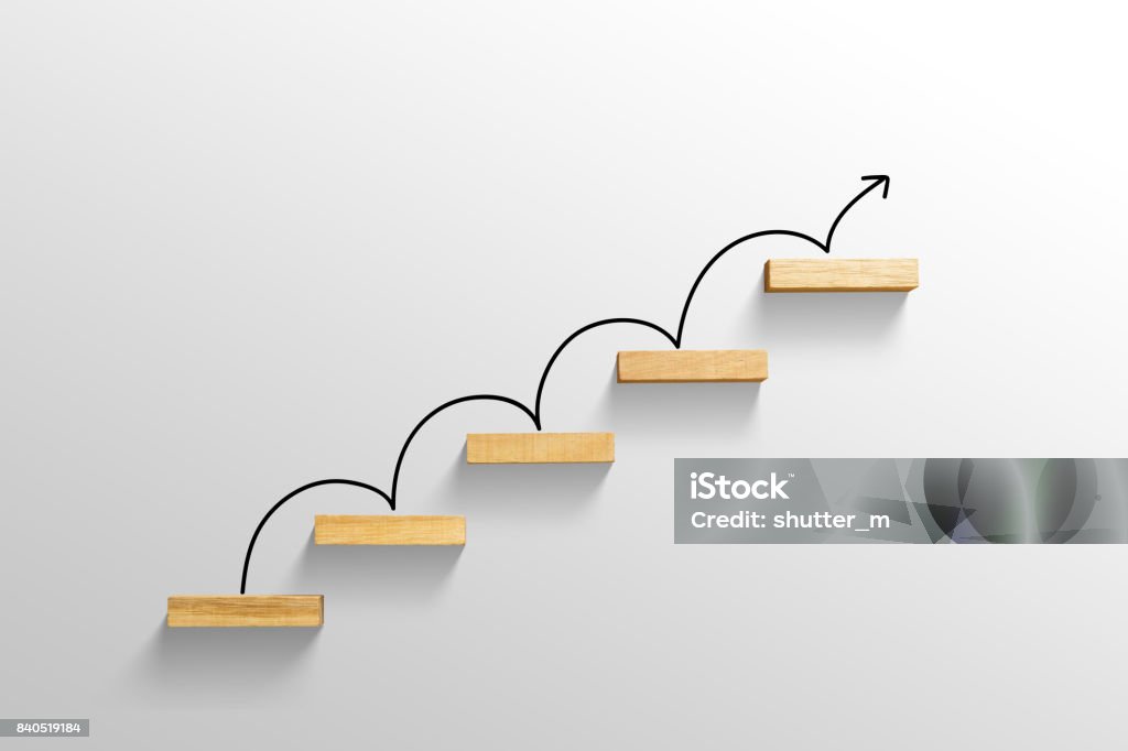 rising arrow on staircase, increasing business Progress Stock Photo