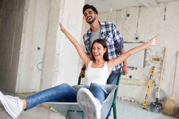 istock Loving couple is having fun while they are renovating house 840522380
