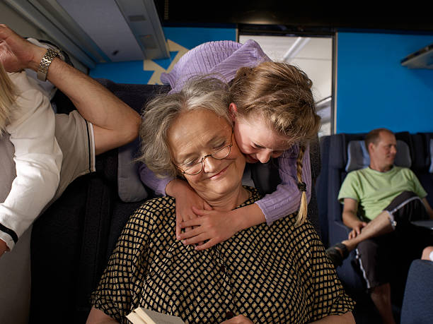 familie auf zug - grandparent family reading inside of stock-fotos und bilder