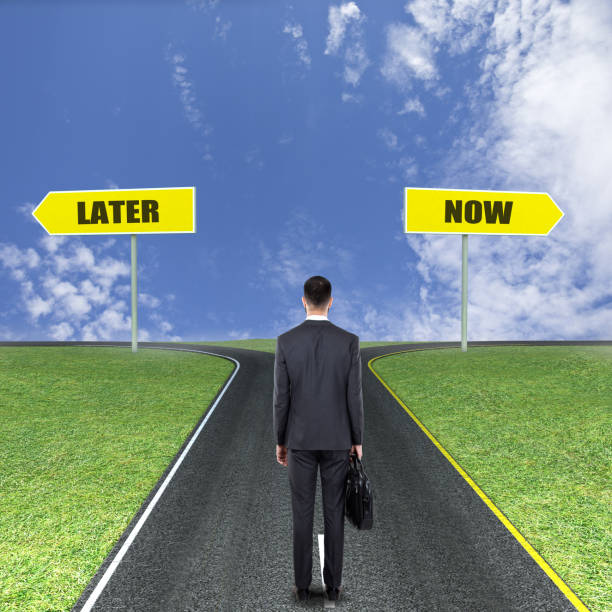 istock Businessman thinking about Later or Now 840526748