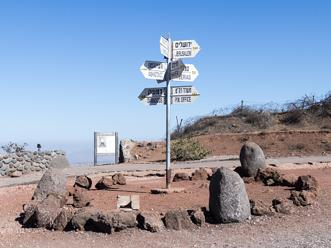 Golan Heights, Israel, August 27, 2017 : Directions sign on Mount Bental on the border between Israel and Syria