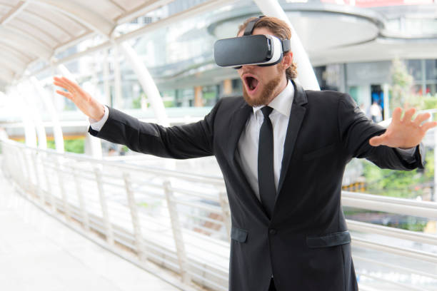 istock Businessman wearing virtual reality goggle glasses and enjoying in this activity, future technology concept, imagine concept 840527286