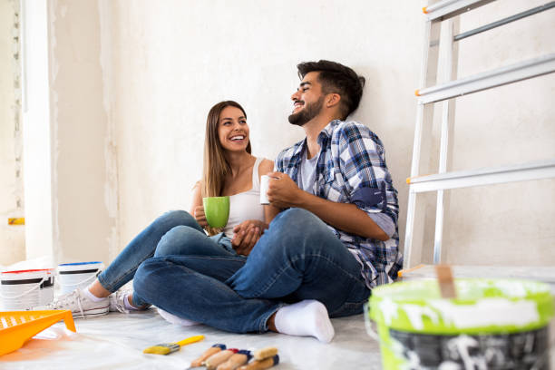 istock Happy smiling couple doing pause with coffee while renovation their home 840530504