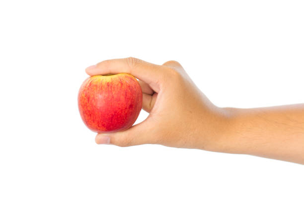 istock Men's hand holding red apple. Isolated on a white background. 840531088