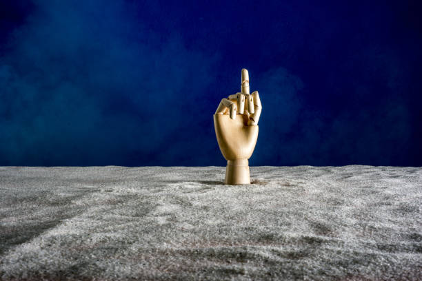 istock A wooden hand gesticulates against a blue background 840536242