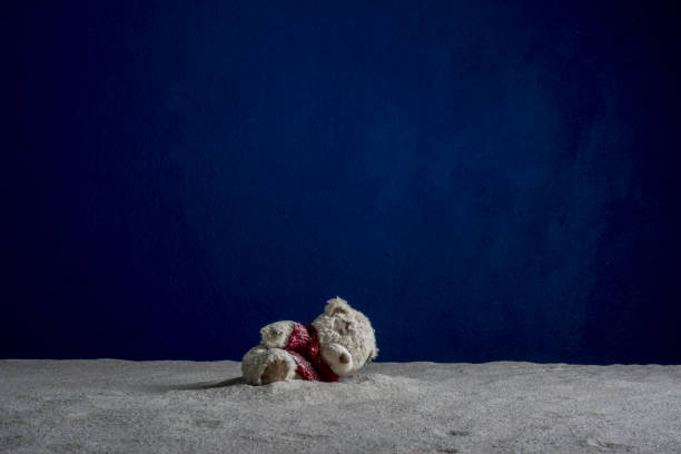 istock Children's toy bear cub on a blue background 840538926