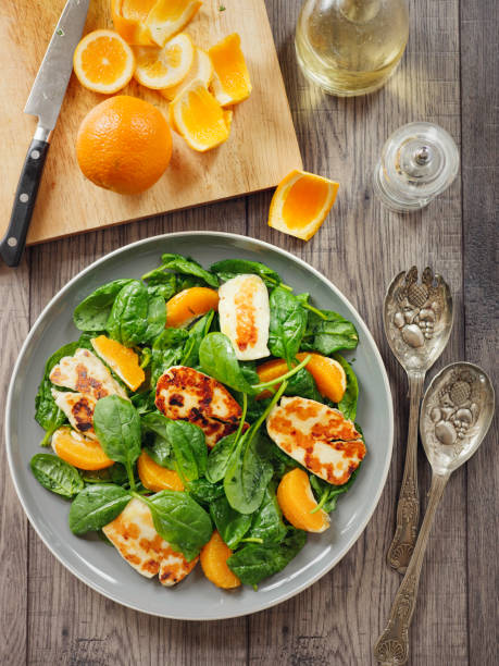 Healthy spinach and orange salad with grilled halloumi cheese