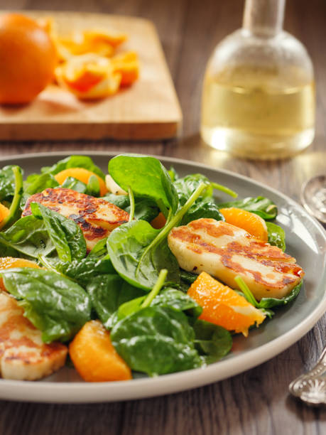 istock Healthy spinach and orange salad with grilled halloumi cheese 840539230