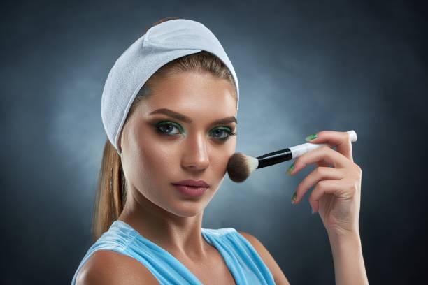 istock Gorgeous woman making professional makeup and posing at camera. 840543464