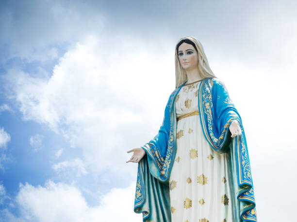 istock The Blessed Virgin Mary Statue blue sky background. 840551270