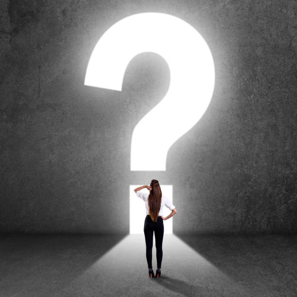 istock Businesswoman looking at question mark 840552416