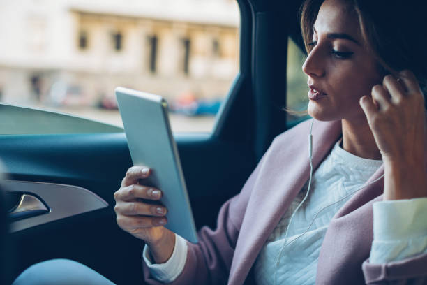 istock Businesswoman working in the car 840556558