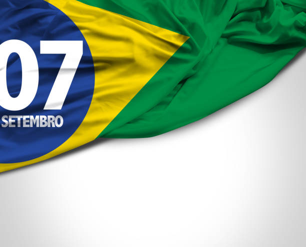 brazil flag outdoors with buildings in the background in Brazil.