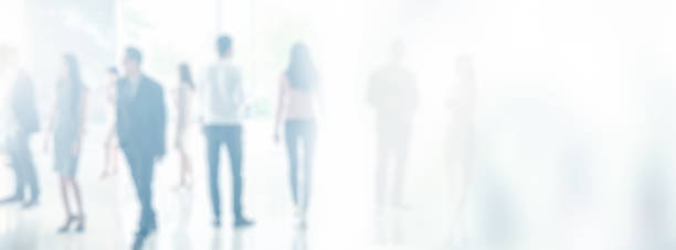 istock Blurred unidentify business people in office interior with space for background or banner design 840565918