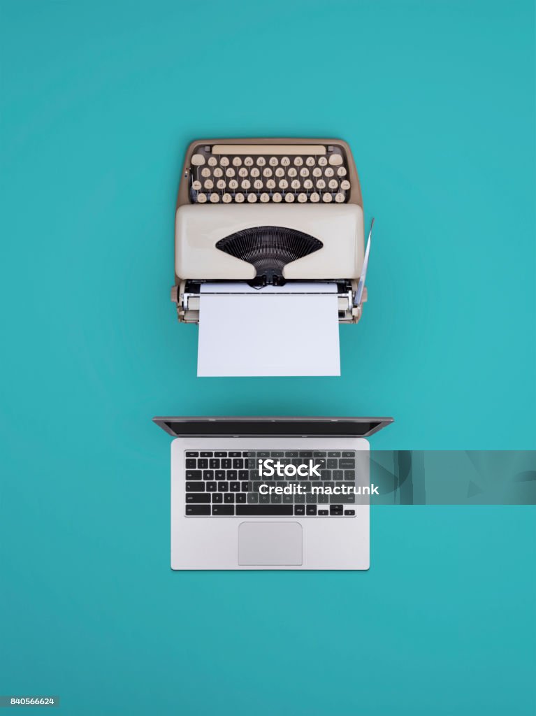 Old vs new And old typewriter vs a new laptop The Past Stock Photo