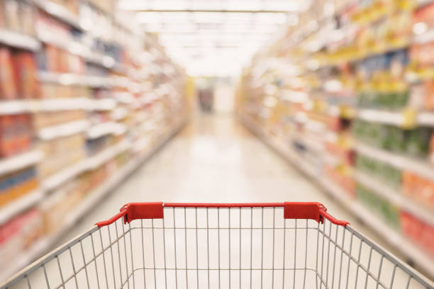 istock Abstract Supermarket aisle with empty shopping cart 840568138
