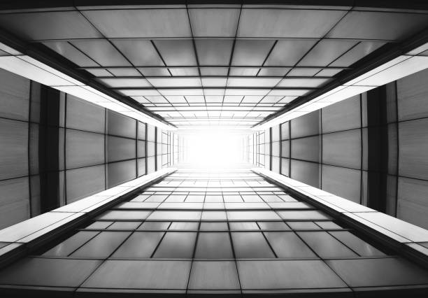 istock windows on high building from bottom view tunnel to the glory light. 840575220