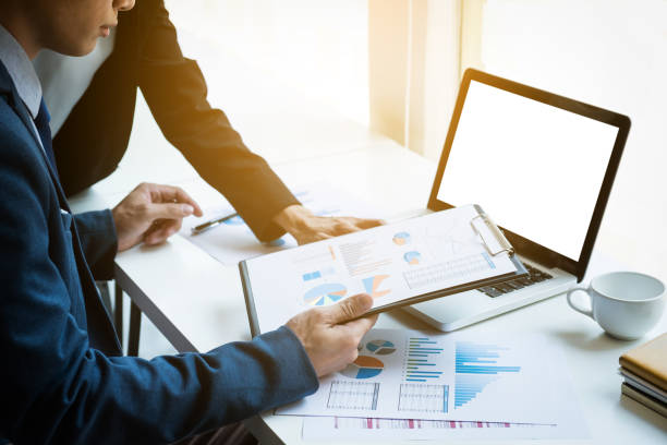 istock Young business manager working with new startup project. discussing the charts and graphs showing the results at meeting. Business accounting and financial concept 840582186